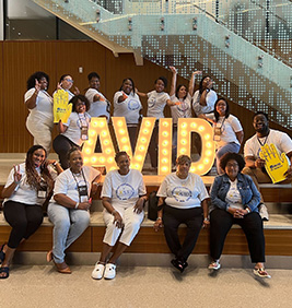 Teachers in front of AVID sign